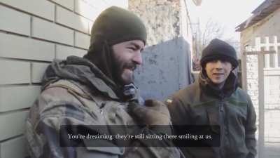 Ukrainian soldiers use an automatic grenade launcher as a mortar near Donetsk Airport.
