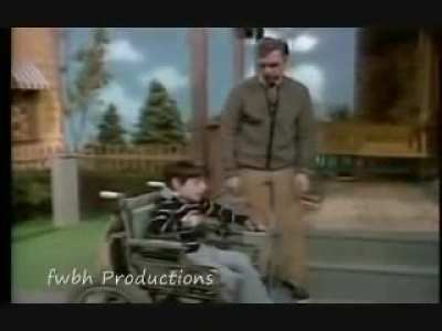 Fred Rogers ignores all ceremony and rushes the stage to say hi to his old friend