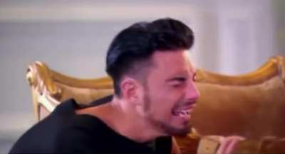 Bellingham opening the door of his hotel room and seeing Quansah sitting on the bed instead of Trent
