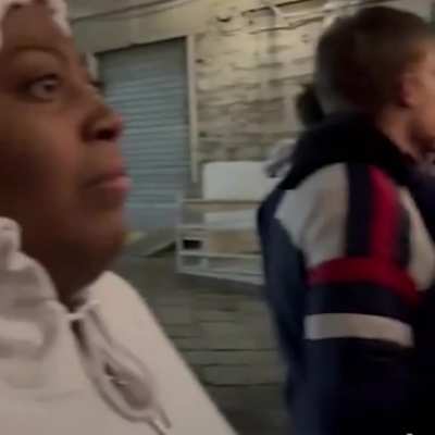 A black woman is reacting to an Easter celebration in Italy.