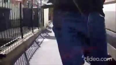 Driver attempts to kick down cyclist but ends up on the ground face-first himself.