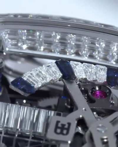 Apart from gold and diamonds, this wrist watch has a miniature W16 engine inside