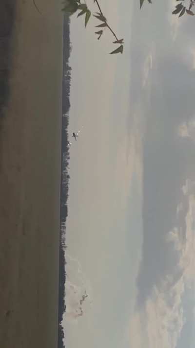 Two Mi-8 attack and transport helicopters approaching at low altitude from behind a tree line, launching a barrage of rockets at a target predetermined by the JTAC team and immediately activating countermeasures while retreating. Published on October 6, 2