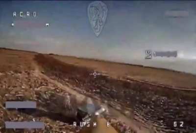 Ukrainian kamikaze drone hits Russian soldier with an unusual cover over him. March 2024 (music from source)