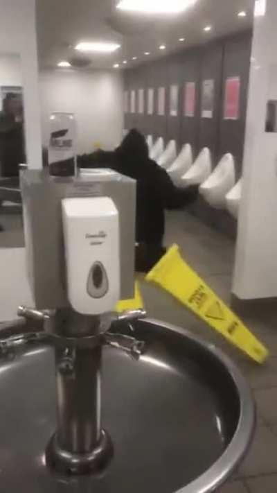 My mate drunk, going for a pee with cones on his feet. What could go wrong?