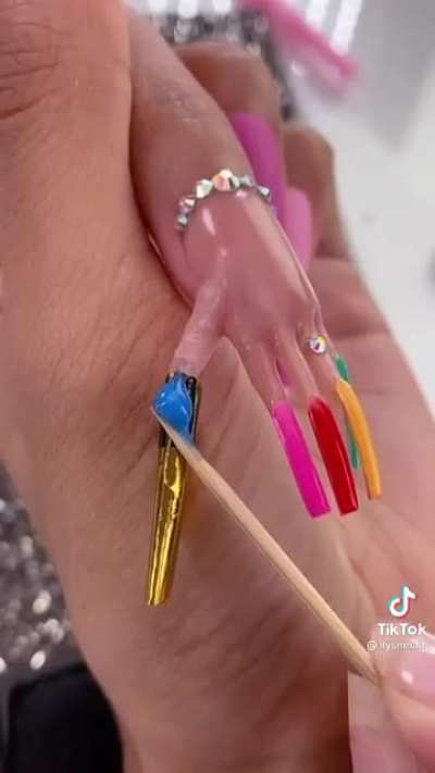 A hand with a finger with a nail of a hand with 5 fingers and nails